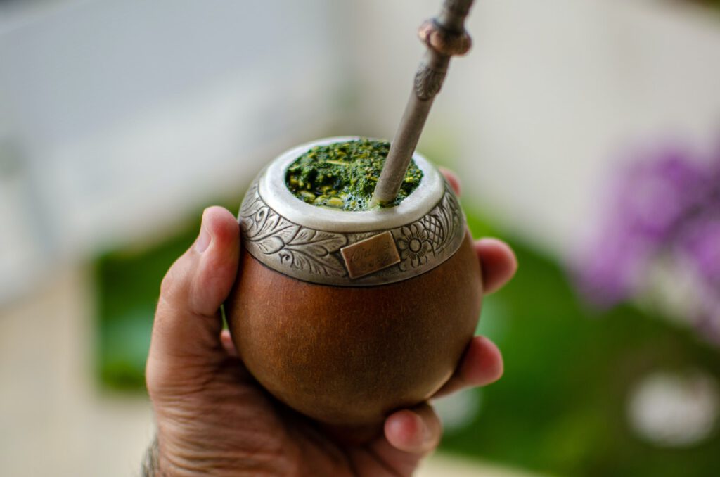 Cup of a yerba mate being hold in hand
